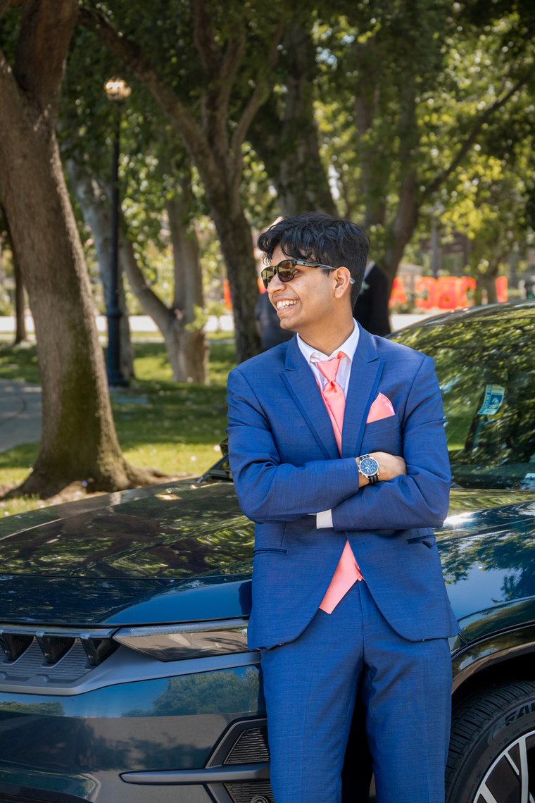 Candid prom portrait with friends in suits