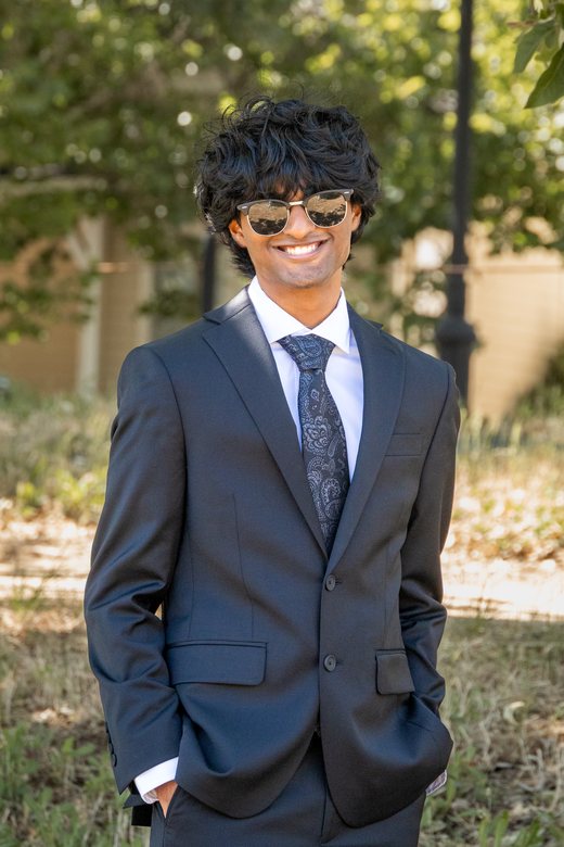 Smiling black suit solo prom portrait