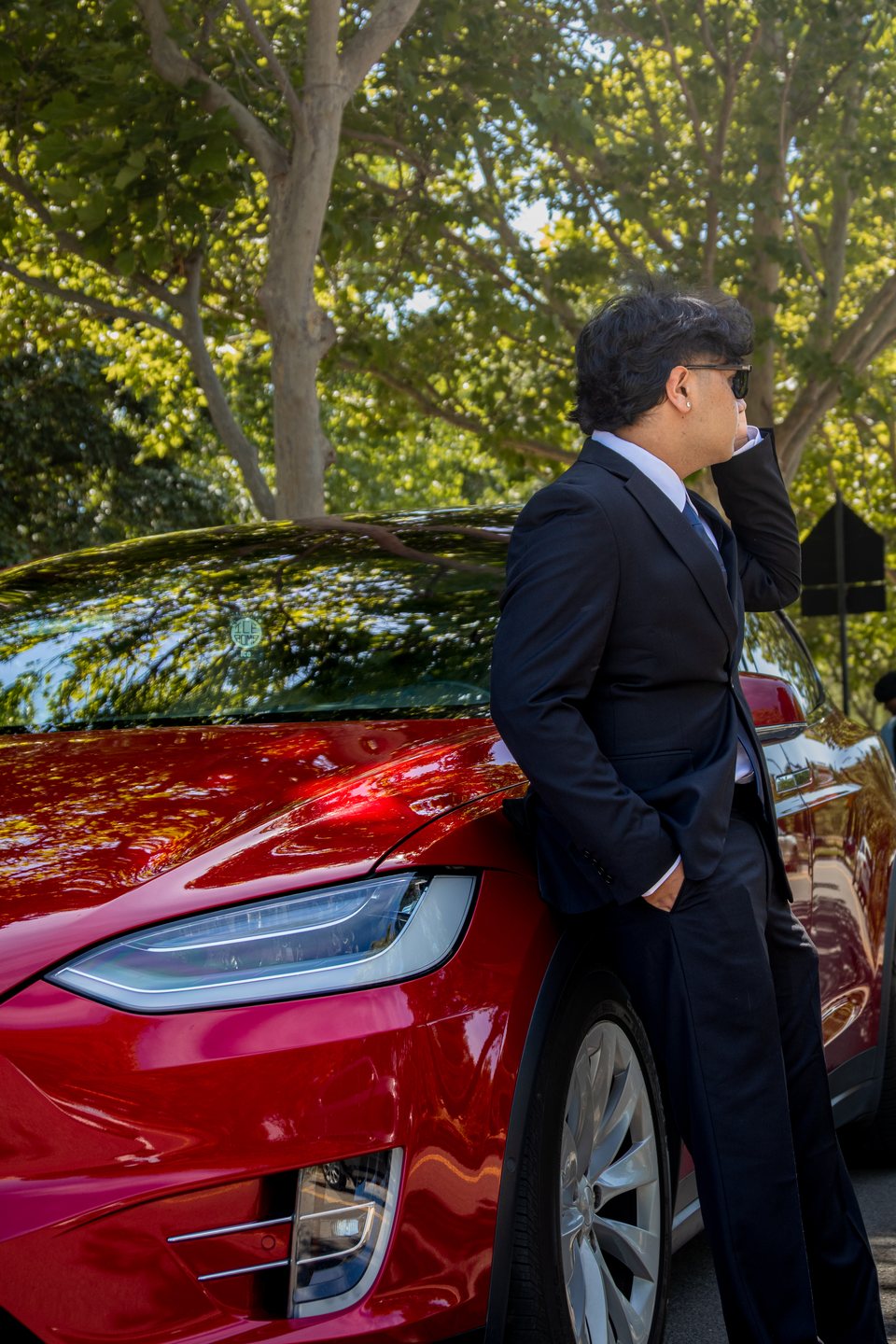 Editorial prom portrait beside red car