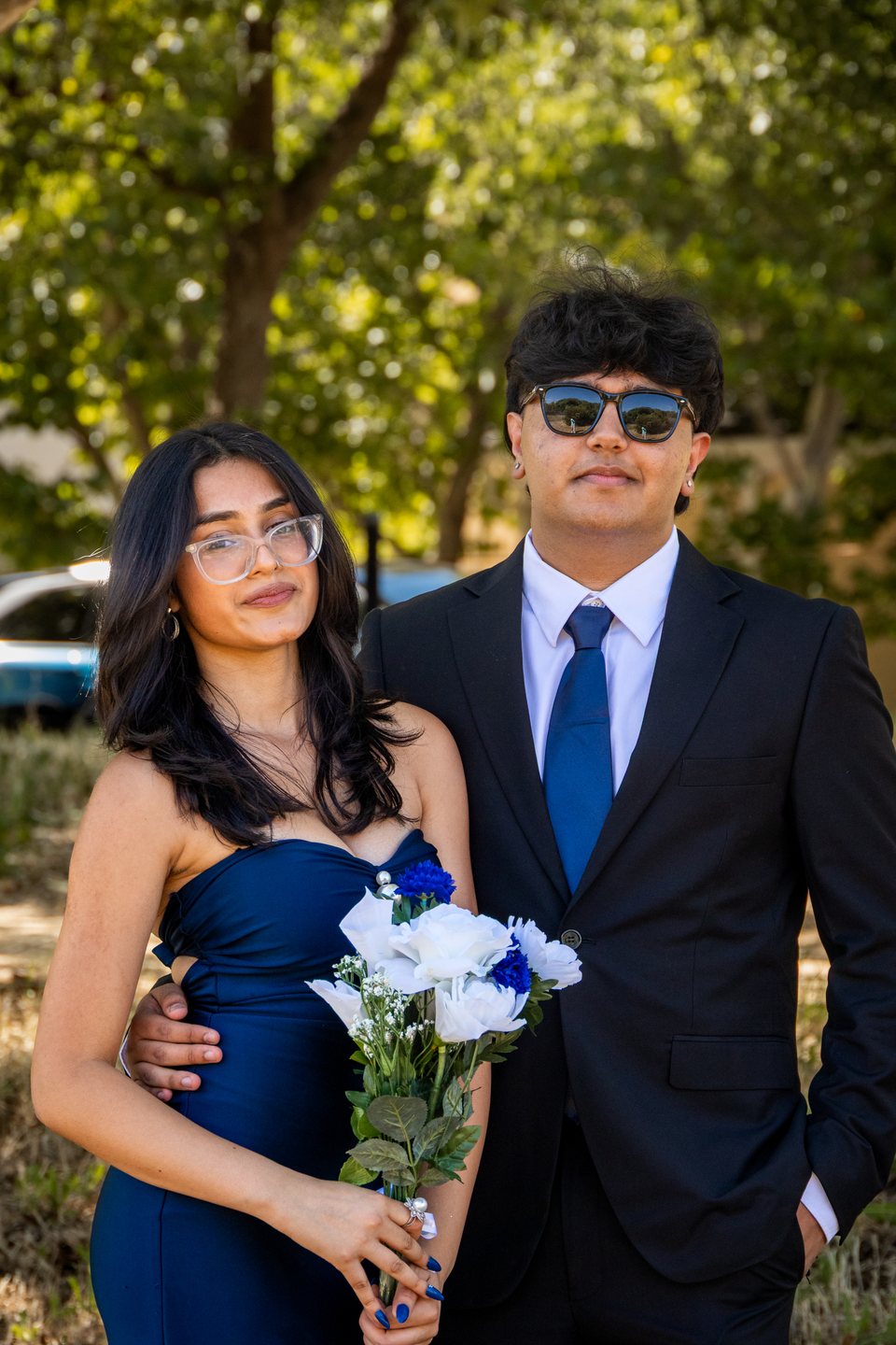 Candid prom couple smiling at each other